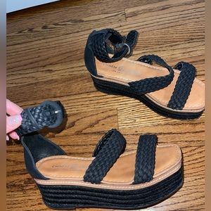 Black Chinese Laundry platform sandals with braided detail/ buckle.